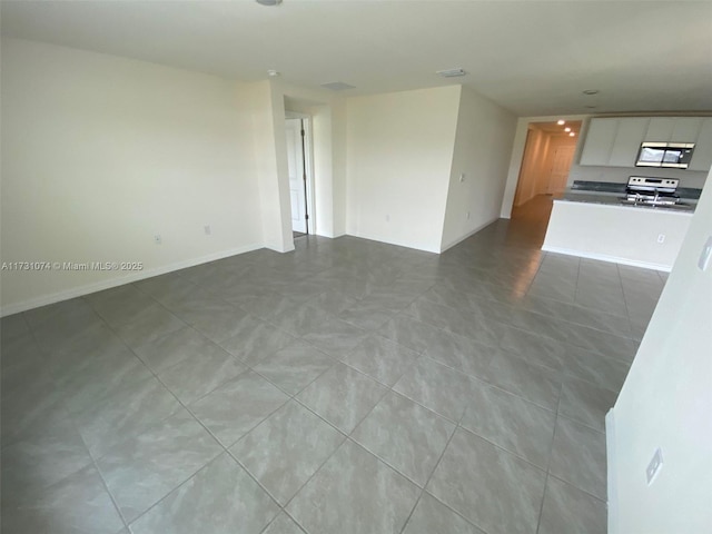 unfurnished living room with light tile patterned floors