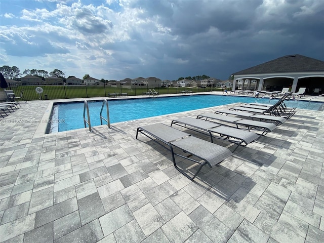 view of swimming pool featuring a patio area