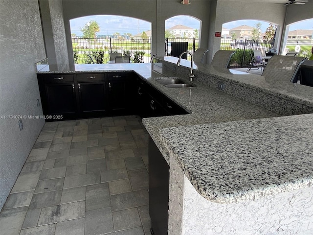 view of patio / terrace featuring exterior kitchen and sink