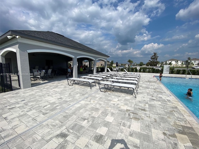 view of swimming pool with a patio area