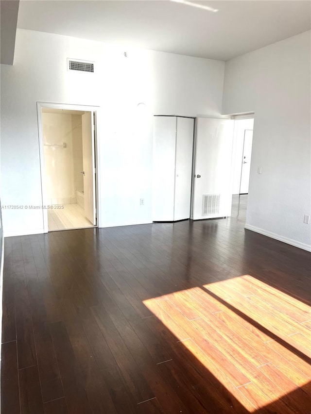 unfurnished room featuring wood-type flooring