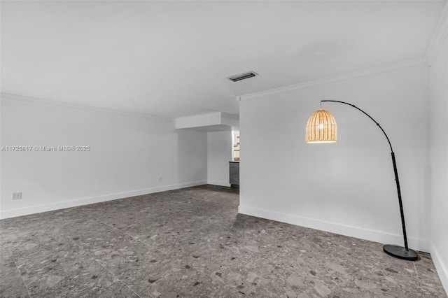 spare room featuring crown molding