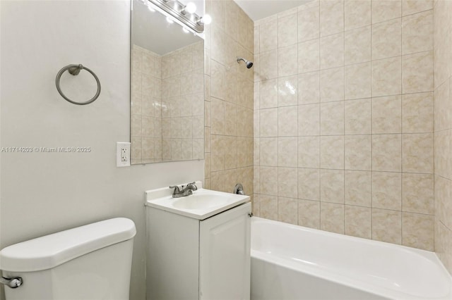 full bathroom featuring vanity, toilet, and tiled shower / bath combo