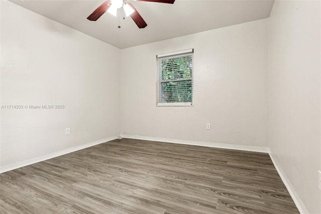 empty room with wood-type flooring and ceiling fan