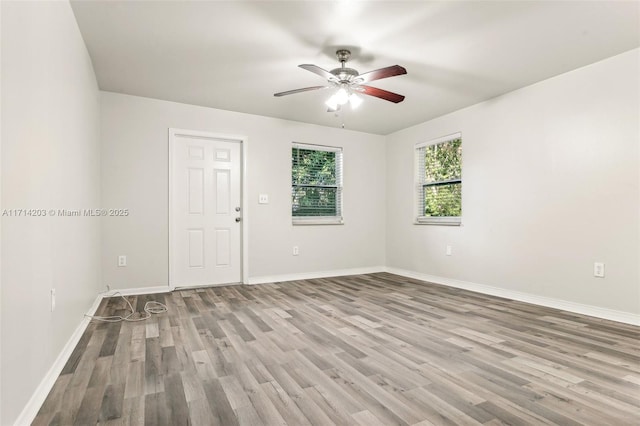 spare room with light hardwood / wood-style floors and ceiling fan