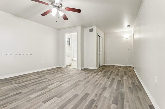 empty room featuring light hardwood / wood-style flooring and ceiling fan