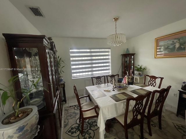 dining room featuring a chandelier