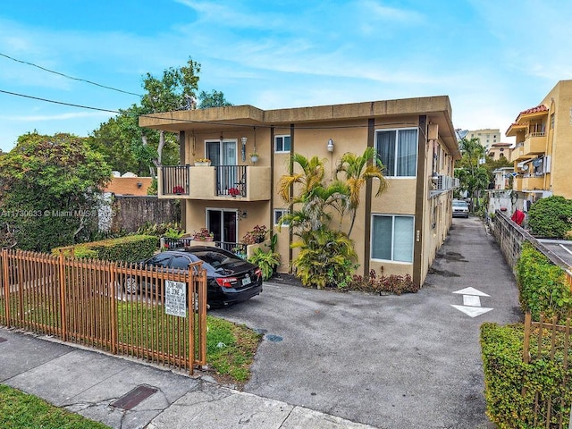 view of front of property with a balcony