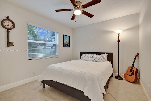 bedroom featuring light tile patterned floors and ceiling fan