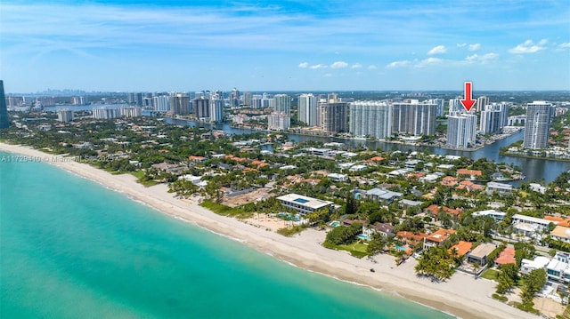 birds eye view of property featuring a water view and a view of the beach