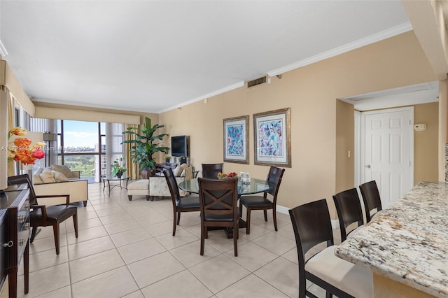 tiled dining area with crown molding