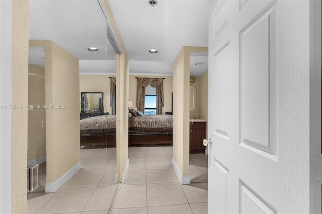 hallway with light tile patterned floors