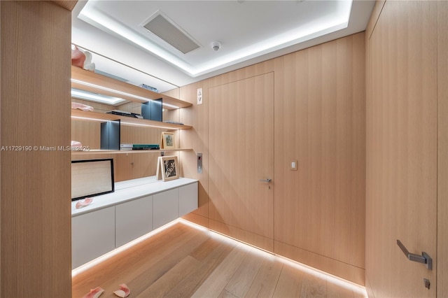 hallway with light hardwood / wood-style flooring