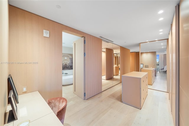 kitchen featuring a kitchen island and light wood-type flooring