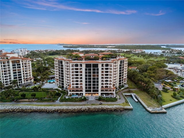 aerial view at dusk with a water view