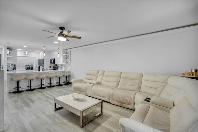 living area featuring ceiling fan, light wood-style flooring, and recessed lighting