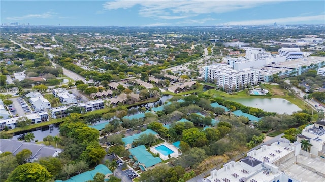 birds eye view of property featuring a water view and a city view