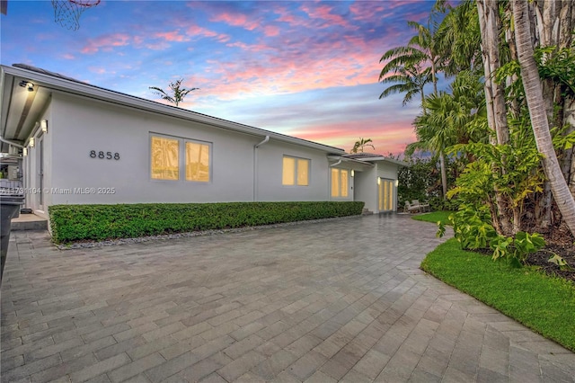 ranch-style house with stucco siding