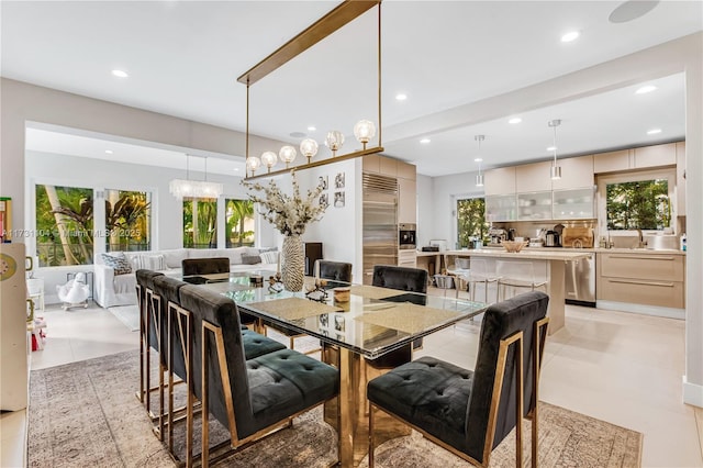 dining room featuring recessed lighting, a healthy amount of sunlight, and light tile patterned flooring