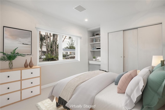 bedroom featuring recessed lighting, visible vents, a closet, and baseboards