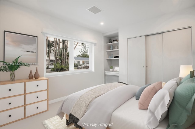 bedroom featuring baseboards, a closet, recessed lighting, and visible vents