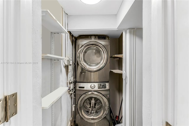 laundry area featuring laundry area and stacked washer and dryer
