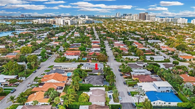 drone / aerial view with a view of city and a water view