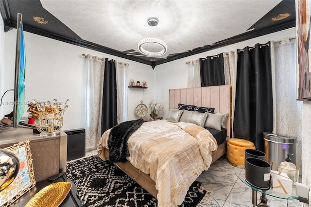 bedroom with a textured ceiling and ornamental molding