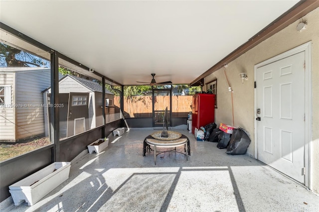 sunroom / solarium featuring ceiling fan