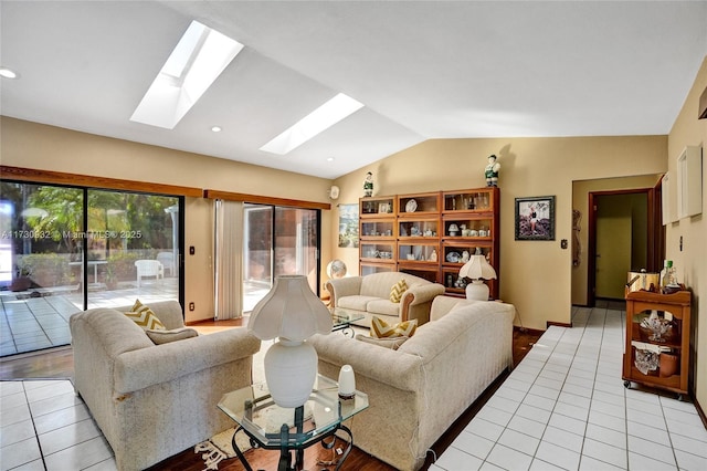 living room featuring vaulted ceiling with skylight and light tile patterned floors