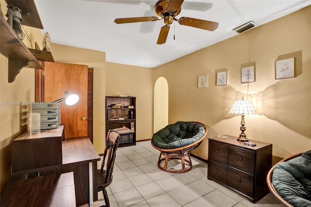 sitting room with light tile patterned floors and ceiling fan