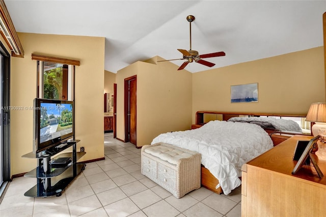 bedroom featuring ceiling fan, vaulted ceiling, and light tile patterned floors