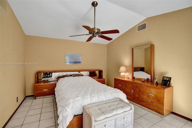 tiled bedroom featuring lofted ceiling and ceiling fan