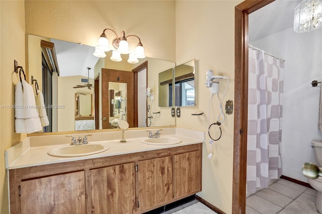 bathroom featuring tile patterned flooring, vanity, toilet, and a shower with curtain