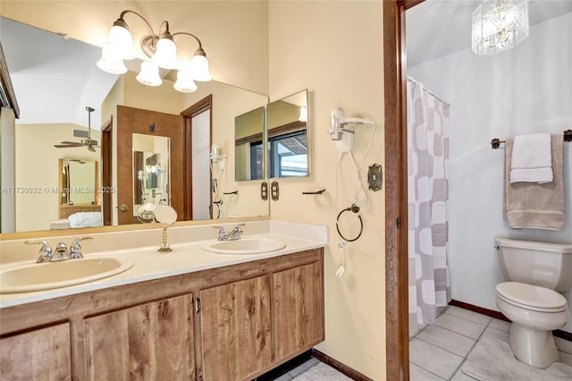 bathroom featuring lofted ceiling, tile patterned flooring, an inviting chandelier, vanity, and toilet