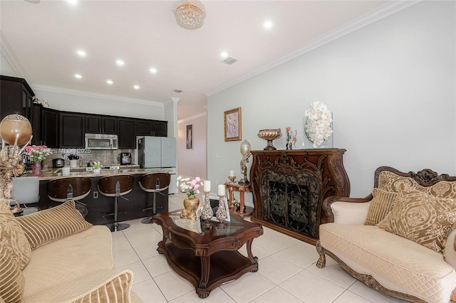 living room with light tile patterned flooring, ornamental molding, and a high end fireplace