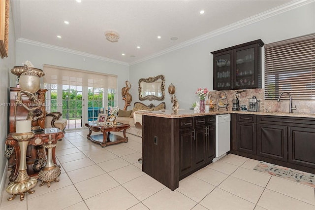 kitchen with tasteful backsplash, ornamental molding, kitchen peninsula, and sink