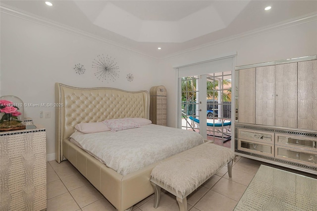 tiled bedroom featuring a tray ceiling, access to outside, ornamental molding, and french doors