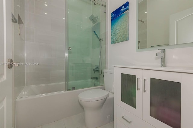 full bathroom with vanity, shower / bath combination with glass door, and toilet