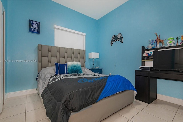 bedroom featuring light tile patterned floors