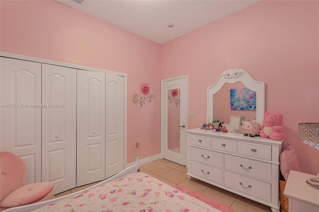 bedroom featuring light tile patterned flooring