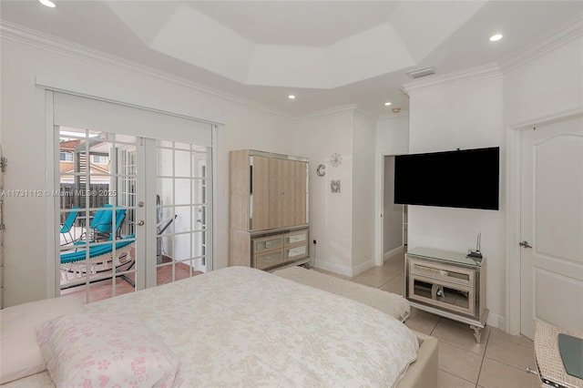 bedroom with crown molding, light tile patterned floors, a raised ceiling, and french doors