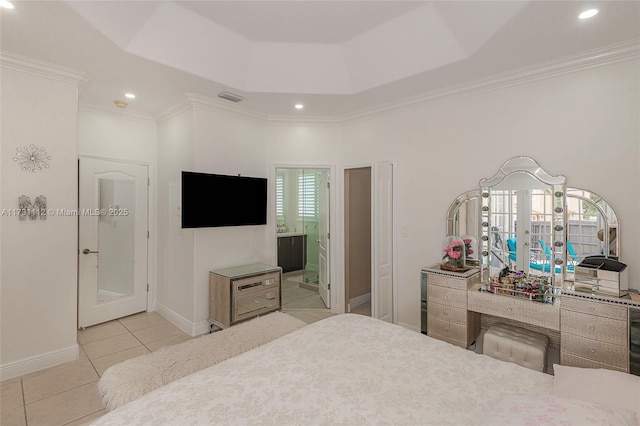 tiled bedroom with a raised ceiling, crown molding, connected bathroom, and french doors