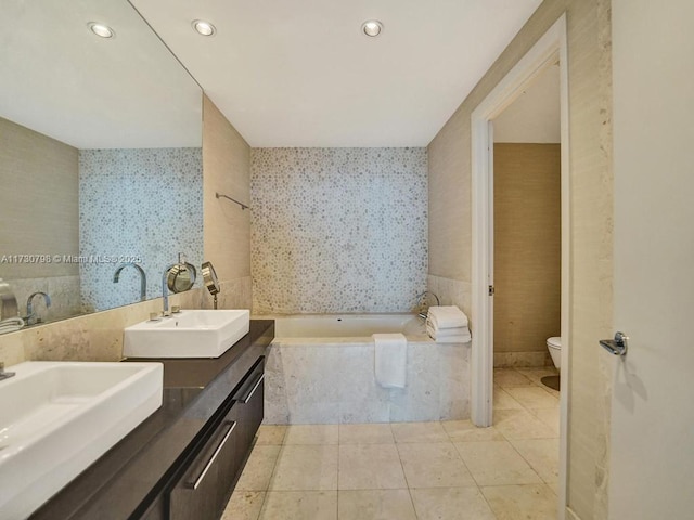 17121 Collins Ave Unit 3905, Sunny Isles Beach, FL 33160 - bathroom with toilet, double vanity, a bath, tile patterned floors, and recessed lighting