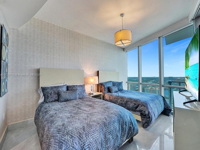 bedroom featuring floor to ceiling windows