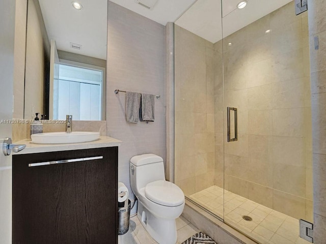 17121 Collins Ave Unit 3905, Sunny Isles Beach, FL 33160 - bathroom with vanity, toilet, a shower stall, and tile patterned flooring