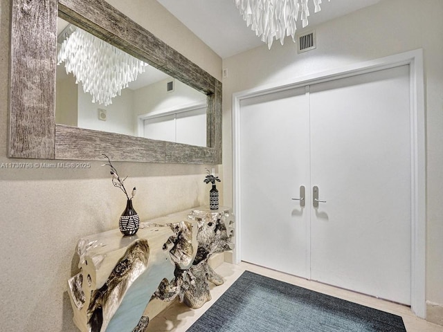 bathroom featuring a chandelier