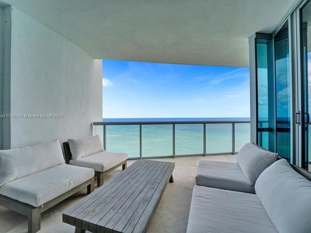17121 Collins Ave Unit 3905, Sunny Isles Beach, FL 33160 - balcony featuring a water view and an outdoor hangout area