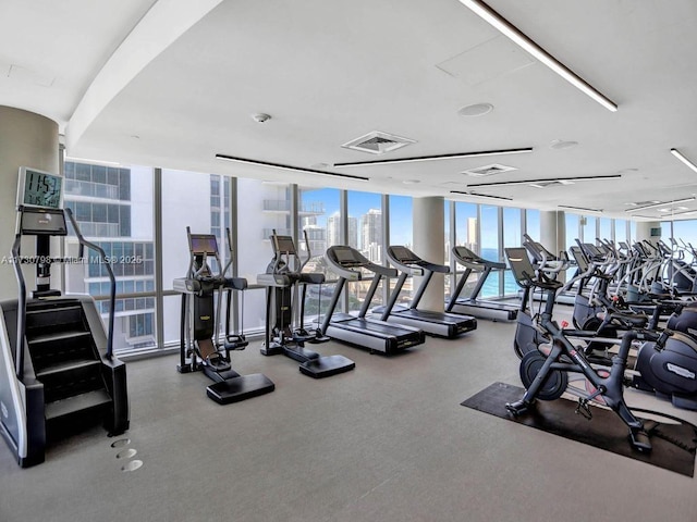 exercise room with floor to ceiling windows