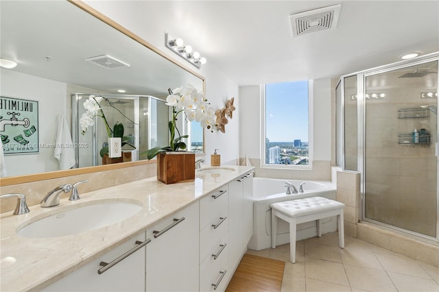 bathroom with vanity, shower with separate bathtub, and tile patterned floors